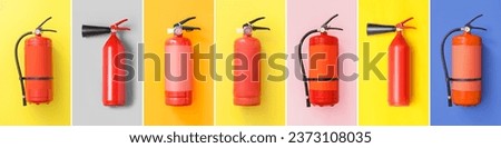 Set of fire extinguishers on color background, top view