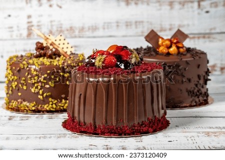 Varieties of chocolate cake. Various birthday cakes on wooden background. patisserie products. Close up