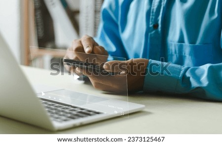 Man using smart phone for streaming online on virtual screen, watching video on internet, live concert, show or tutorial, content online.
