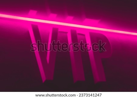 Sign letters word vip very important person, popularity and status in pink neon light.