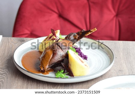 rabbit leg with cabbage and dumpling, served food in a restaurant