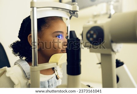 Child, eye exam and optometry for medical, vision and healthcare consultation or glaucoma check. Young client or girl kid with laser technology, blue light or machine scanning and ophthalmology test Royalty-Free Stock Photo #2373161041