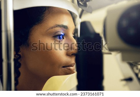 Woman, eye test and opthalmology at clinic for vision, cataract and optic health with slit lamp examination. Face, female patient and optometrist for prescription lenses for glaucoma with diabetes Royalty-Free Stock Photo #2373161071