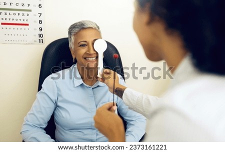 Eye exam, woman and optometrist with cover for vision, healthcare and tool for focus or test at optometry. Eyes assessment, ophthalmology and person for medical support, glaucoma or retina testing Royalty-Free Stock Photo #2373161221