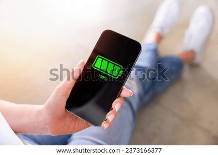 Fully charged mobile phone, full battery icon Royalty-Free Stock Photo #2373166377