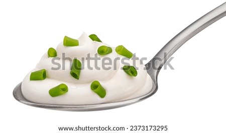 Spoon of sour cream with green onion isolated on white background, full depth of field Royalty-Free Stock Photo #2373173295