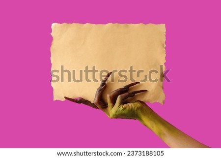 Witch with paper sheet on purple background. Halloween celebration