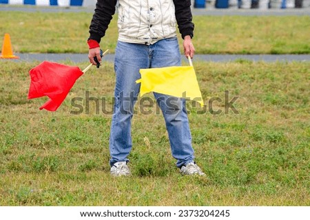 Background on the theme of sports. Hands with red and yellow flags.