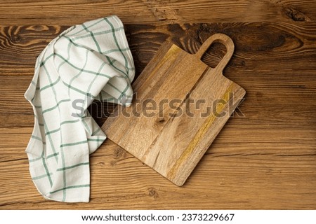 Empty Cutting Board Texture Background, Wooden Chopping Board Mockup with Copy Space for Text, Rustical Kitchen Mock up with Tablecloth, Cloth Napkin Fabric Background Flat Lay, Top View Royalty-Free Stock Photo #2373229667