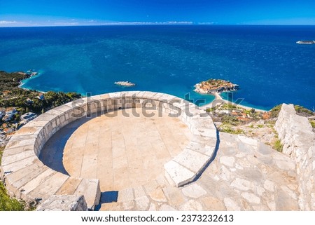 Sveti Stefan historic island village and waterfront view from viewpoint, archipelago of Montenegro Royalty-Free Stock Photo #2373232613