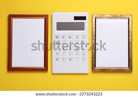 Calculator with frames on yellow background