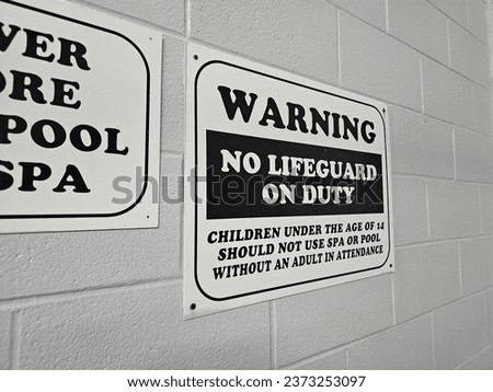 A sign warning that no lifeguard is on duty.