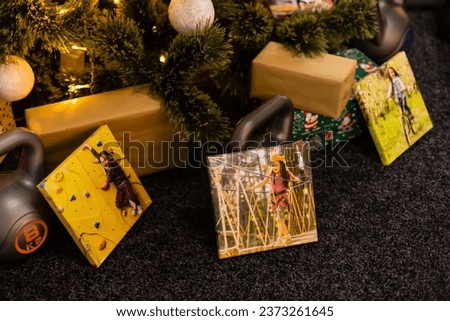 Square canvas and weights for sports as a gift. Christmas and New Year concept.