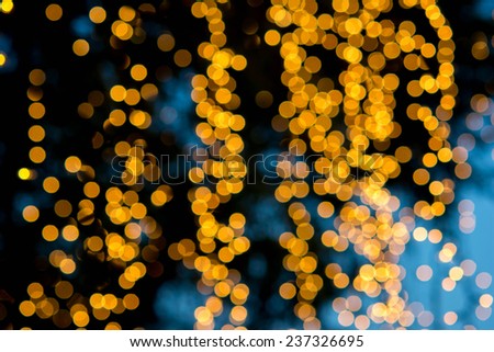 Christmas background. Festive abstract background with bokeh defocused lights and stars 