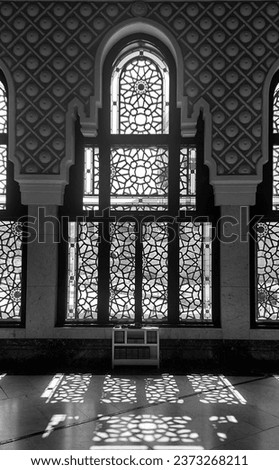 The light passing through the geometric pattern of window in Masjid Al-Haram, kaaba, Makkah, Saudi Arabia. Royalty-Free Stock Photo #2373268211