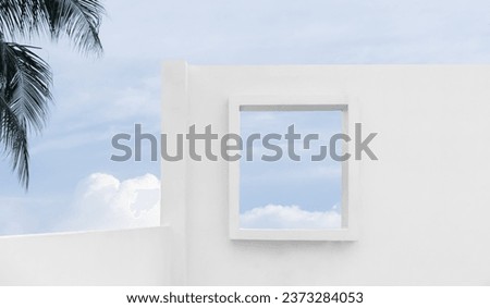 Architecture with Wall concrete texture with open window against blue sky and clouds, Exterior White cement house, Minimal Modern building with summer sky and palm leaves tree Royalty-Free Stock Photo #2373284053