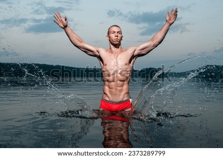 Muscular man in the water Royalty-Free Stock Photo #2373289799