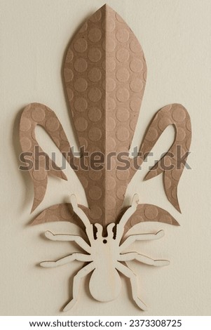 wooden spider and brown floral decor shape with crease 
