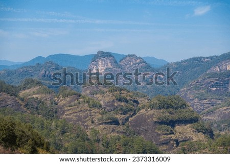 Panoramic picture of the lotus shaped mountains in Wuyishan, Fujian, China. Blue sky with copy space for text