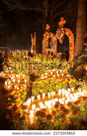 Tzintzuntzan,Michoacan; November 1 2022: Celebration of Day of the Dead with decoration of the cemetery and a candlelight vigil. One of the most important celebration in Mexico and the Lake Patzcuaro  Royalty-Free Stock Photo #2373343863