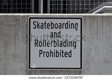 SKATEBOARDING AND ROLLERBLADING PROHIBITED sign