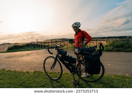  Traveller on bicycle. Solo travel long distance bicycle touring concept. High quality illustration Royalty-Free Stock Photo #2373353713