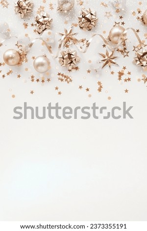 Christmas background with Xmas golden decor pattern top view on white backdrop with copy space.Beautiful Xmas greeting card. Poster.New Year decoration frame mockup.