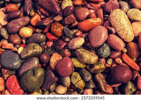 Natural vintage colorful pebbles background.