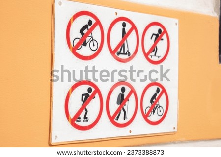 Road signs prohibiting sports. Signs on the door prohibit various sports.