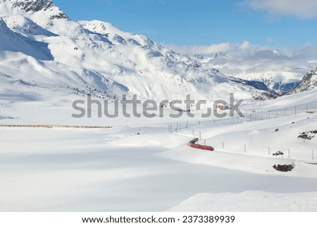 Red Express in the Winter Season Photo, Lake Bianco Pontresina, Switzerland Royalty-Free Stock Photo #2373389939