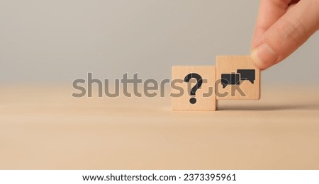 Q and A concept. Q and A symbols on wooden cube blocks on a grey background. Illustration for frequently asked questions concepts in websites, social networks, business issues. Recommendation concept.