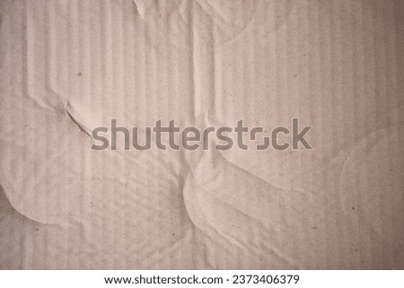 Cardboard surface from a paper box for packing,designs decoration.Old Kraft paper box craft pattern.