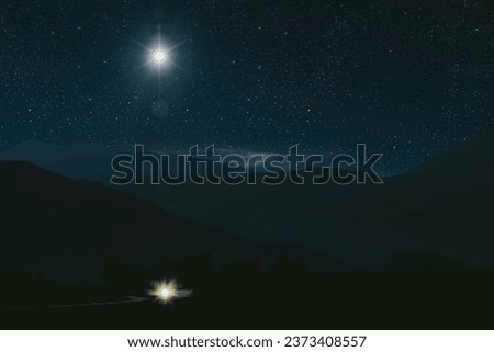 a Christmas star shines at night over the mountains of Bethlehem
