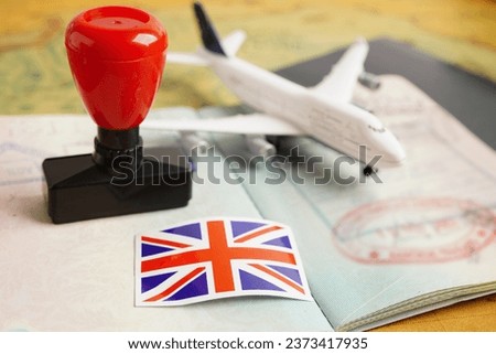 Visa and passport document with atamp and United Kingdom flag  to immigration at airport in country. 