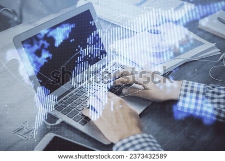 Multi exposure of businessman working on laptop on background. International business hologram in front. Concept of success.