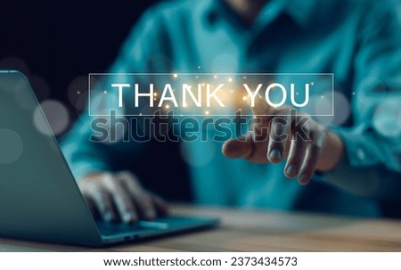 businessman using a laptop and touching the message thank you on a display screen. concept of thank you business, congratulations, and appreciation gratitude. presentation from technology digital
