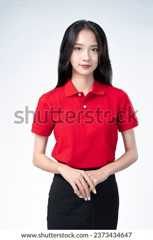 Southeast Asian beauties in red shirts, black skirt  Royalty-Free Stock Photo #2373434647