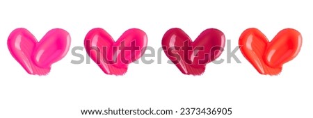 Set of hearts from liquid lipstick in pink and red colours isolated on white background. Lipstick smear smudge texture different hue colors isolated on white background. Lipgloss swatch set. 