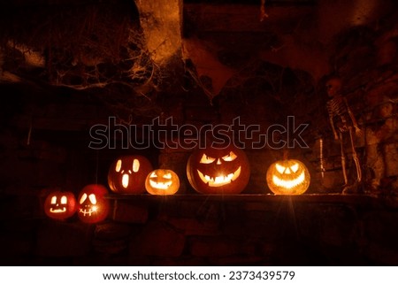 scary Halloween background with Jack'o'lanterns and skeleton