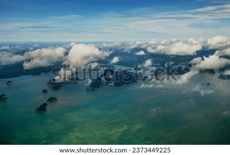 the picture from the sky filled with cloudy islands look beautiful