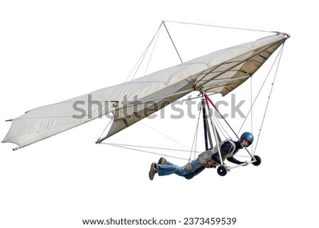 Old vintage hang glider kite wing with pilot isolated on white Royalty-Free Stock Photo #2373459539