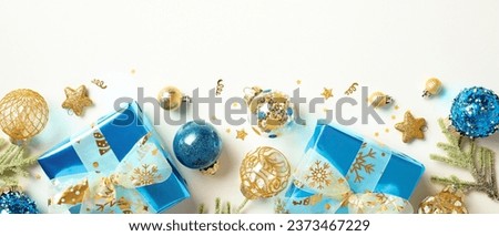 Christmas banner with blue and gold decorations and gift boxes on white background. Flat lay, top view.