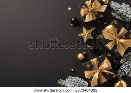 Deluxe holiday wishes concept. Top view of luxurious gift packages, costly tree trimmings, gold and black balls, sparkling confetti, frosted fir twigs on dark backdrop with space for festive words Royalty-Free Stock Photo #2373484081