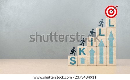 Goal is constant skill growth, improvement of personal skills in business, life and career. Upskilling and personal development concept. Upskilling, reskilling, new skills icon on wooden cube. Royalty-Free Stock Photo #2373484911