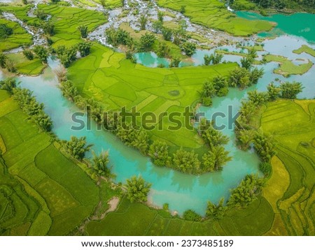 Aerial landscape in Quay Son river, Trung Khanh, Cao Bang, Vietnam with nature, green rice fields and rustic indigenous houses. Travel and landscape concept. Royalty-Free Stock Photo #2373485189