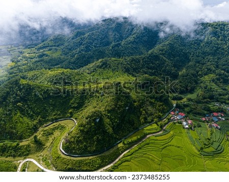Aerial landscape in Quay Son river, Trung Khanh, Cao Bang, Vietnam with nature, green rice fields and rustic indigenous houses. Travel and landscape concept. Royalty-Free Stock Photo #2373485255