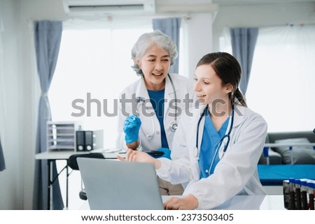Hospital Ward. Doctor Talks With Professional Head Nurse or Surgeon, They Use Digital tablet Computer. Diverse Team of Health Care Specialists Discussing Test Result in hospital 