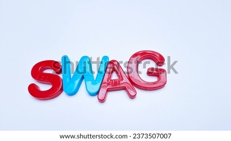 Magnet letters SWAG on a white background.