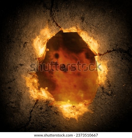 Concrete wall with a hole with fire flame background. Scary Halloween background concept