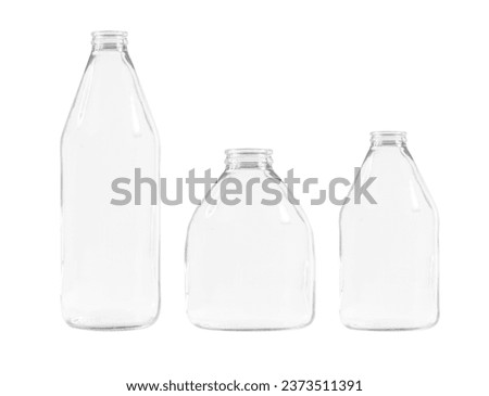 Kit. transparent glass bottles of different shapes and sizes. on an empty background.  Royalty-Free Stock Photo #2373511391
